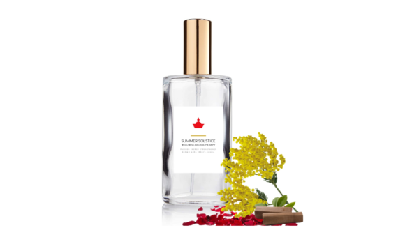 a bottle of room spray with rose petals, sandalwood sticks and mimoza